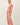 Model wearing pink cotton modal fleece sweatshirt, side view