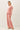 Model wearing pink cotton modal fleece sweatshirt, side view
