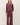 Full-length view of model wearing burgundy sweater with matching pants