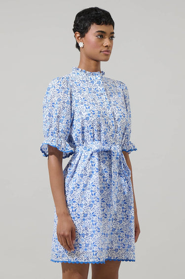 Model wearing Maisie Floral Miana Button Up Mini Dress in a side view