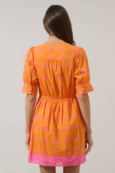 Back view of Donna Dot Elanie Button Down Mini Dress in orange pink with floral pattern and cinched waist design.