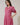 Model wearing Fawna Shift Mini Dress Kendrie Floral with pink and blue floral pattern, split neckline, and puff sleeves.