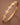 18K Gold PVD Plated Waterproof Stainless Steel Bangle displayed diagonally on a brown background