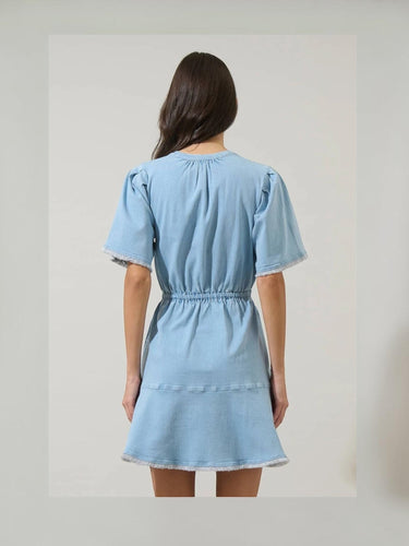 Back view of the Gabriella Denim Fray Mini Dress featuring fringe details and a relaxed fit.