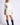 Chiara white long-sleeve pullover sweater on model, three-quarter view