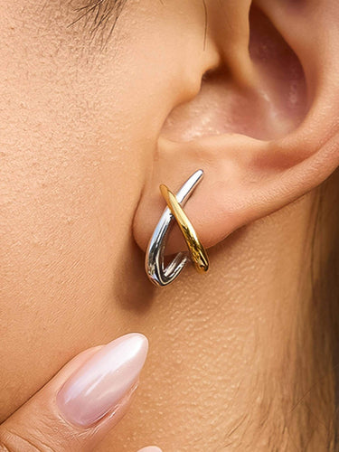 Staven 18K Gold Non-Tarnish Two Tone Crossover Earrings worn in ear, featuring sleek silver and gold design.