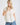 White collared V neck button down line lace detail shirt with blue denim jeans