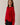 Side view of model wearing red Round Rolled Hemline Detail Thin Sweater Cardigan with black shorts