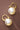 18K Gold PVD Plated Stainless Steel Pearl Drop Earrings 8036 displayed on a dark background