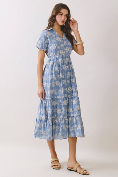 Embroidered Floral Tiered Button Down Midi Dress in blue with a collared neckline and tiered skirt on a model.