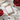 Hope Small Sachet Fragrance by Greenleaf surrounded by fresh raspberries and berries on a wooden surface.