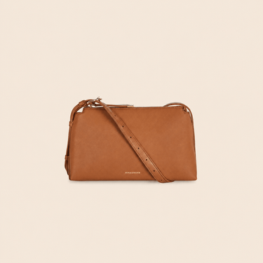 Mira & Moss Audrey Crossbody Bag in brown vegan leather with adjustable strap and gold-tone hardware.
