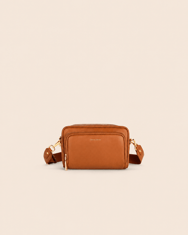 Mira & Moss Lucienne Crossbody Bag in tan vegan leather with gold-tone hardware and adjustable strap.