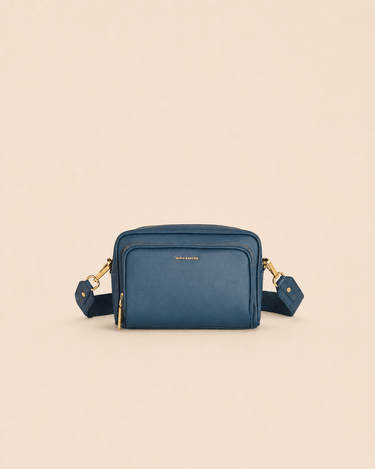 Mira & Moss Lucienne Crossbody Bag made of premium vegan leather in blue with gold-tone hardware.