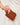 Bryer Card Holder Chocolate displayed in hand with a stylish leather-look finish.