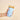 Sip Savvy Drink Sleeve Large Oh So Fancy Blue holding an iced drink, featuring a floral design and snug fit for comfortable use.