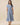 Embroidered Floral Tiered Button Down Midi Dress on model, showcasing a collared neckline and tiered skirt in blue.