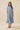 Embroidered Floral Tiered Button Down Midi Dress on model, showcasing a collared neckline and tiered skirt in blue.
