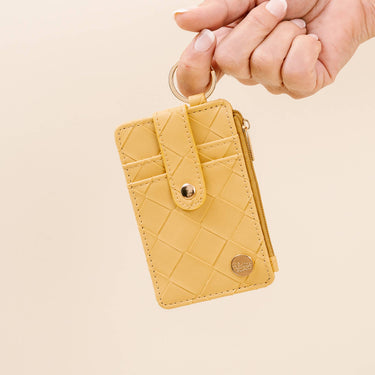 Keychain Wallet - Woven Mustard held in hand, featuring faux leather and zippered pocket, perfect for essentials.