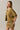 Side view of model wearing mustard yellow short sleeve sweater cardigan