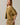Side view of model wearing mustard yellow short sleeve sweater cardigan