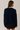 Back view of model wearing navy blue Round Rolled Hemline Detail Thin Sweater Cardigan