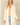 Shop Wall open front cardigan in cream with long sleeves and side pockets worn by a blonde model
