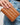 Jocelyn Wallet Tan held in hand, showcasing its quilted texture and compact design.