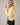 Model wearing yellow Round Rolled Hemline Detail Thin Sweater Cardigan with navy shorts