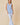 V-neck Baby doll Sleeveless Blouse with Ruffle Top worn by model, showcasing vertical ruffle detailing in light blue.
