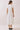 Back view of Classic Shirt Collar Neck Pleated Detail Dress highlighting pleated panel detailing.