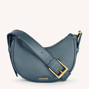 Mira & Moss Sabine Crescent Crossbody Bag in premium vegan leather with gold-tone hardware and adjustable strap.