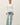 Model wearing white raglan sleeve slub pullover sweater, front view