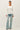 Model wearing white raglan sleeve slub pullover sweater, front view