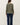 Back view of sage green raglan sleeve slub pullover sweater on model