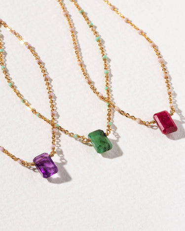 Prism Gems Birthstone Necklace - February featuring amethyst and elegant gold chain with pastel enamel stations.