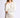 Model wearing Chiara long-sleeve pullover sweater in white