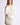 Model wearing Chiara long-sleeve pullover sweater in white