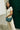 Mira & Moss Sabine Crescent Crossbody Bag worn by a model, showcasing its vegan leather and stylish design.