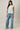 crew neck sleeveless diagonal panel stripe top full length outfit view