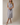 V NECK CAP SLEEVE BUTTON UP WAIST TIE BELT MIDI DRESS worn by a model, showcasing button details and a waist tie.