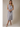 V NECK CAP SLEEVE BUTTON UP WAIST TIE BELT MIDI DRESS worn by a model, showcasing button details and a waist tie.