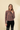 Striped Knit Cardigan long sleeve button up worn by a model against a neutral background.