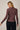 Back view of model wearing burgundy Mock Neck Long Sleeve Button Up Top