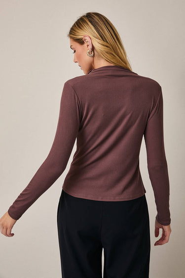 Back view of model wearing burgundy Mock Neck Long Sleeve Button Up Top