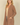 Shop Wall open front cardigan in brown with long sleeves and side pockets worn by a blonde model