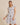 ROUND NECK RUFFLE SHORT SLEEVE FLORAL PRINT DRESS worn by model who is 5'10" and wearing size small