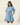 Gabriella Denim Fray Mini Dress with fringe details and cinched tie-waist, styled in light denim color.