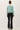 Back view of model wearing purple [NEW COLOR] Ribbed Crewneck Cardigan in mint green.