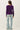 Back view of model wearing purple Ultra Soft Boatneck Basic Long Sleeve Top with blue jeans